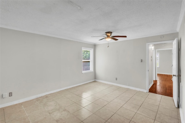 11515 Duane St, Houston, TX 77047 - empty room featuring a textured ceiling, crown molding, ceiling fan, and light tile patterned floors