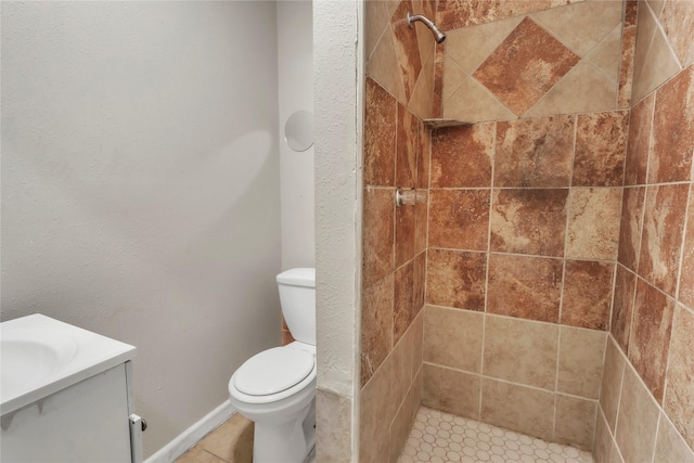 11515 Duane St, Houston, TX 77047 - full bathroom featuring a tile shower, vanity, and tile patterned floors