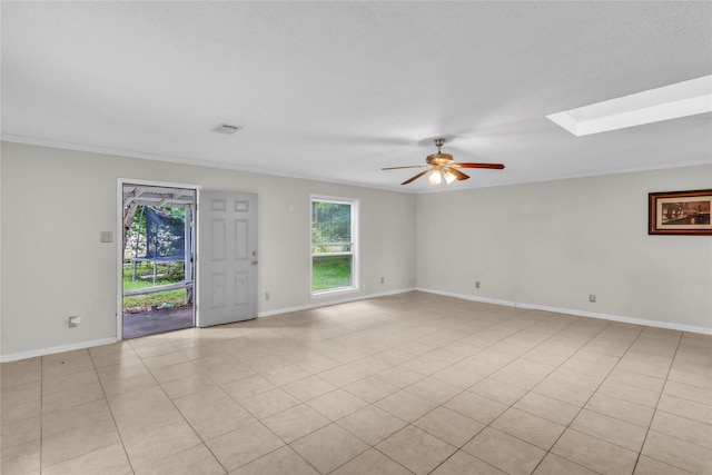 11515 Duane St, Houston, TX 77047 - empty room featuring a ceiling fan, crown molding, and a skylight