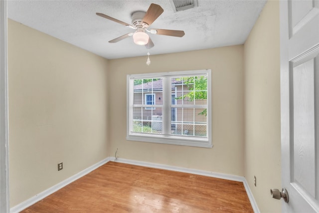 11515 Duane St, Houston, TX 77047 - unfurnished room with light wood-style floors, ceiling fan, and a textured ceiling