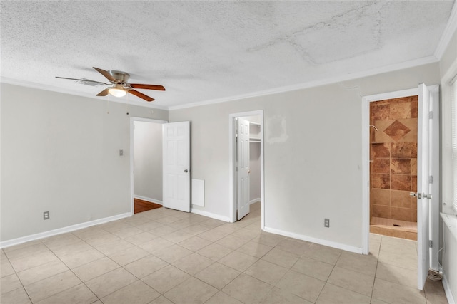 11515 Duane St, Houston, TX 77047 - unfurnished bedroom with ornamental molding, a textured ceiling, a spacious closet, light tile patterned flooring, and a ceiling fan