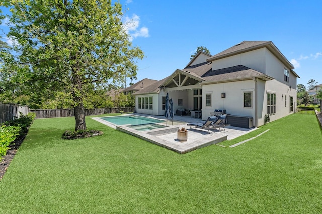 22 Mayapple Blossom Pl, Tomball, TX 77375 - rear view of house with a fenced backyard, stucco siding, a patio, and a pool with connected hot tub