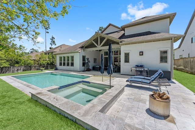 22 Mayapple Blossom Pl, Tomball, TX 77375 - rear view of property featuring a patio, stucco siding, a fenced backyard, a pool with connected hot tub, and a shingled roof