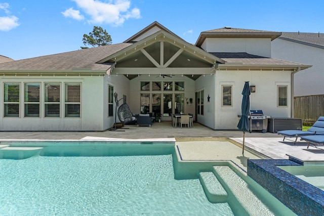 22 Mayapple Blossom Pl, Tomball, TX 77375 - rear view of house featuring an in-ground hot tub, ceiling fan, a patio area, and an outdoor pool