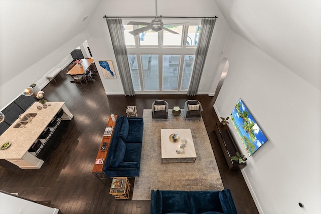 22 Mayapple Blossom Pl, Tomball, TX 77375 - living room featuring hardwood / wood-style flooring, vaulted ceiling, a ceiling fan, and arched walkways
