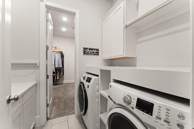 22 Mayapple Blossom Pl, Tomball, TX 77375 - laundry room with washer and clothes dryer, cabinet space, light tile patterned flooring, recessed lighting, and light carpet