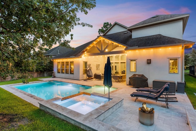 22 Mayapple Blossom Pl, Tomball, TX 77375 - back of property featuring stucco siding, a patio area, an outdoor fire pit, and a fenced backyard
