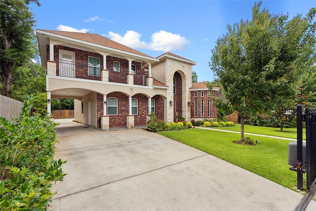 4511 Palo Pinto Dr, Houston, TX 77041 - mediterranean / spanish home with a carport, brick siding, concrete driveway, and a balcony