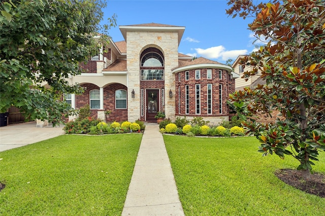 4511 Palo Pinto Dr, Houston, TX 77041 - view of front of property featuring a front yard, brick siding, stone siding, and a shingled roof