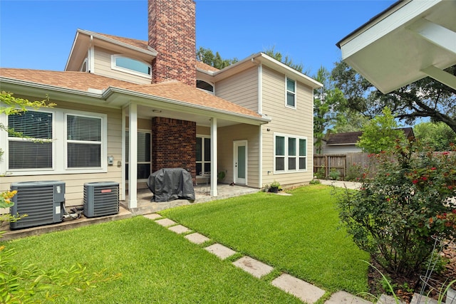 4511 Palo Pinto Dr, Houston, TX 77041 - rear view of property with a chimney, a patio area, and a shingled roof