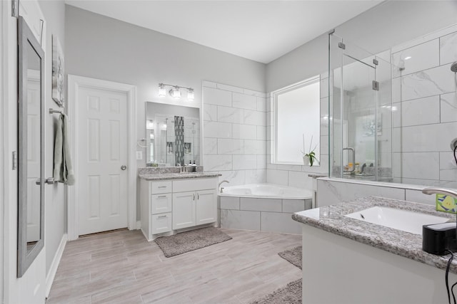 4511 Palo Pinto Dr, Houston, TX 77041 - bathroom featuring two vanities, a shower stall, and a garden tub