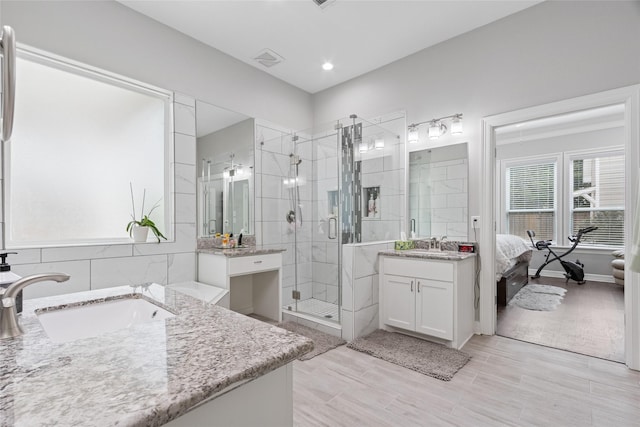 4511 Palo Pinto Dr, Houston, TX 77041 - full bath with two vanities, a shower stall, and ensuite bath
