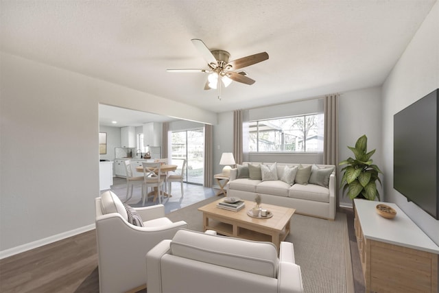 1310 Beaver Bend Rd, Houston, TX 77088 - living room with a ceiling fan and wood finished floors