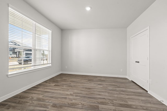 104 Water Grass Trl, Clute, TX 77531 - unfurnished room featuring dark wood-style floors and recessed lighting
