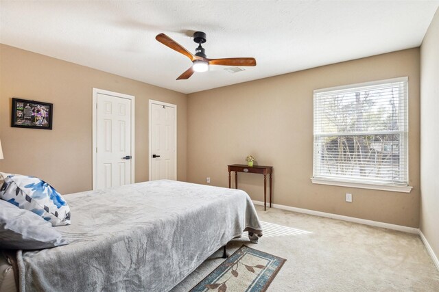 3919 Park Circle Way, Houston, TX 77059 - bedroom featuring carpet floors, ceiling fan, and two closets