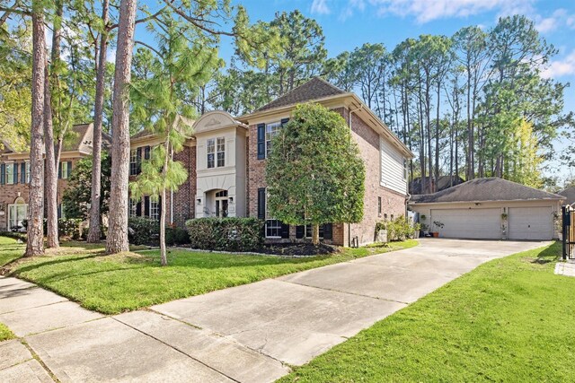 3919 Park Circle Way, Houston, TX 77059 - view of front facade featuring brick siding, a front yard, and a detached garage