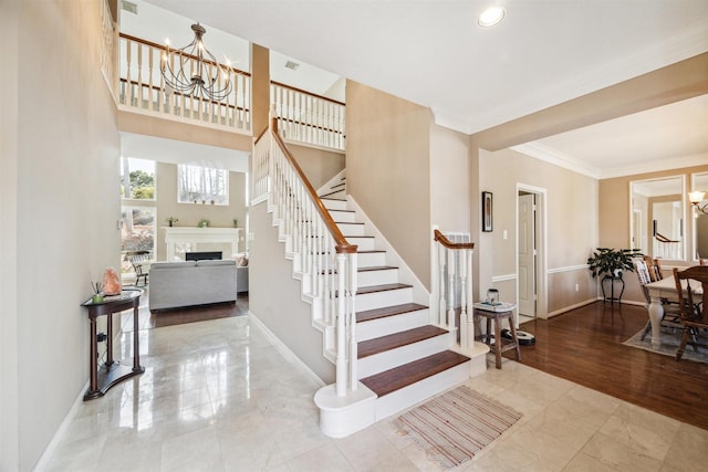 3919 Park Circle Way, Houston, TX 77059 - staircase with a chandelier, a fireplace, ornamental molding, and recessed lighting