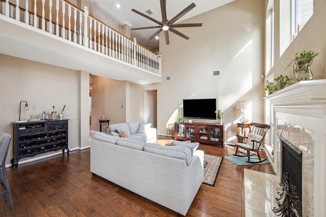 3919 Park Circle Way, Houston, TX 77059 - living area with a ceiling fan, a high ceiling, wood finished floors, and a fireplace