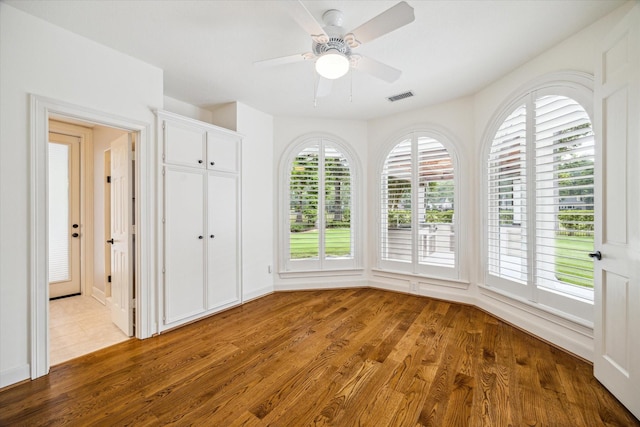 30 Halfmoon Ct, The Woodlands, TX 77380 - unfurnished bedroom featuring wood finished floors and a ceiling fan
