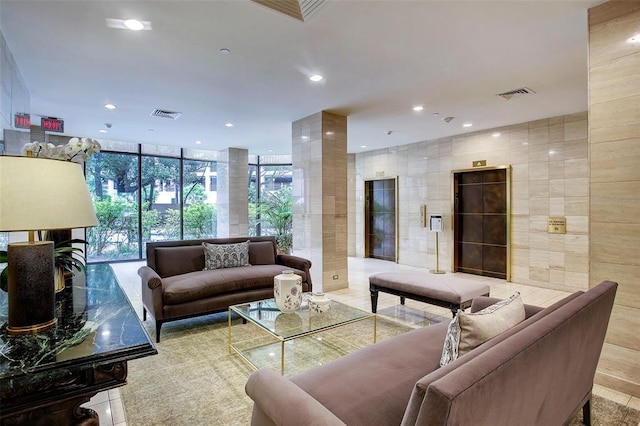 14 Greenway Plz Unit 12L, Houston, TX 77046 - common area with a wall of windows, recessed lighting, and tile walls