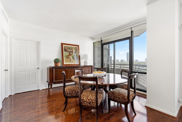 14 Greenway Plz Unit 12L, Houston, TX 77046 - dining room with dark wood-style flooring, a city view, and a wall of windows