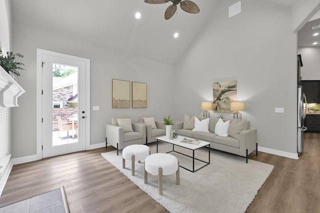 2172 Greentree Dr, Huntsville, TX 77340 - living area with high vaulted ceiling, a ceiling fan, wood finished floors, and recessed lighting