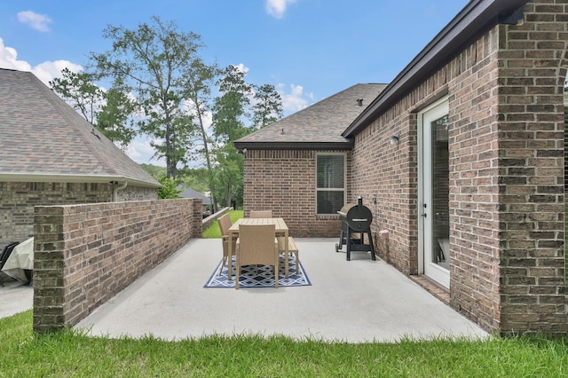 2172 Greentree Dr, Huntsville, TX 77340 - view of patio with grilling area and outdoor dining space