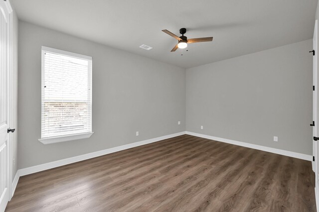 2172 Greentree Dr, Huntsville, TX 77340 - unfurnished room with a ceiling fan and dark wood-style flooring