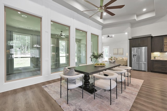 2172 Greentree Dr, Huntsville, TX 77340 - dining area featuring a ceiling fan, wood finished floors, healthy amount of natural light, a high ceiling, and recessed lighting
