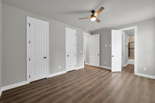 2172 Greentree Dr, Huntsville, TX 77340 - unfurnished bedroom with wood finished floors, ensuite bath, and a ceiling fan