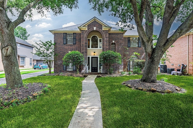 1526 Pecan Crossing Dr, Richmond, TX 77406 - view of front of property featuring brick siding and a front lawn