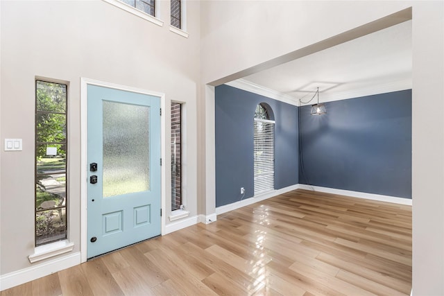 1526 Pecan Crossing Dr, Richmond, TX 77406 - foyer featuring healthy amount of natural light, wood finished floors, and crown molding