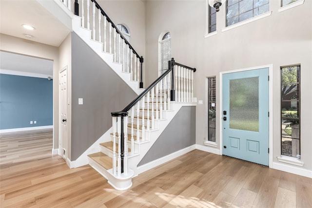 1526 Pecan Crossing Dr, Richmond, TX 77406 - entryway featuring wood finished floors, a high ceiling, plenty of natural light, and stairway