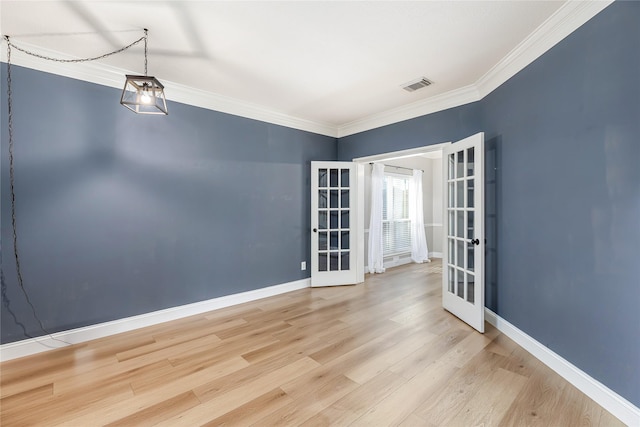 1526 Pecan Crossing Dr, Richmond, TX 77406 - spare room with french doors, wood finished floors, and crown molding