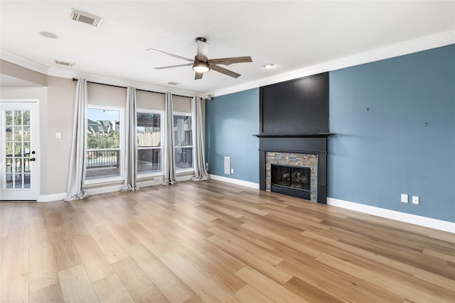 1526 Pecan Crossing Dr, Richmond, TX 77406 - unfurnished living room with crown molding, a ceiling fan, a fireplace, and light wood finished floors