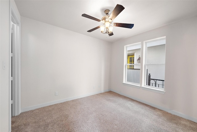 1048 W 21st St, Houston, TX 77008 - carpeted spare room with baseboards and a ceiling fan