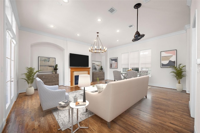1048 W 21st St, Houston, TX 77008 - living area with crown molding, wood finished floors, a fireplace, recessed lighting, and a chandelier