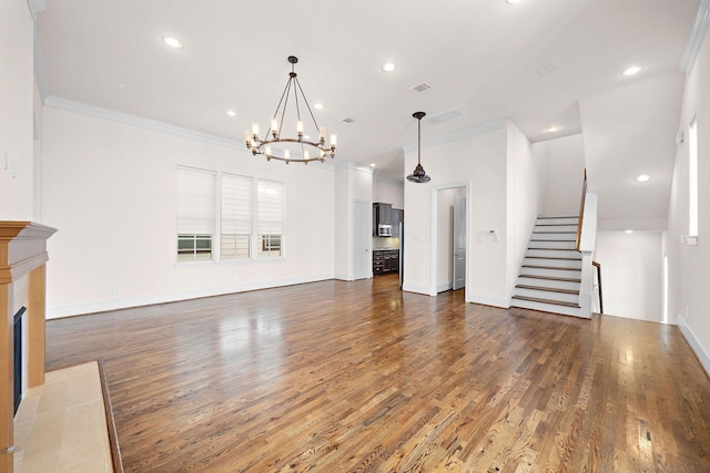 1048 W 21st St, Houston, TX 77008 - unfurnished living room with stairs, a chandelier, wood finished floors, crown molding, and recessed lighting