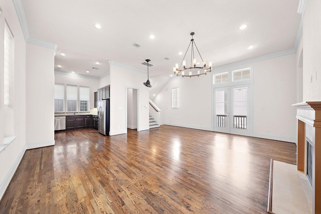1048 W 21st St, Houston, TX 77008 - unfurnished living room featuring a fireplace with flush hearth, ornamental molding, stairs, a chandelier, and recessed lighting