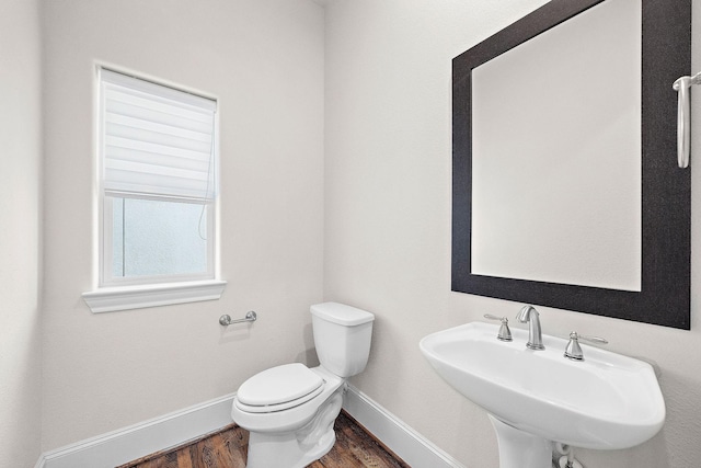 1048 W 21st St, Houston, TX 77008 - half bath featuring a sink and wood finished floors
