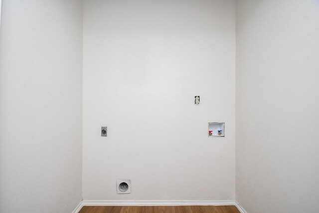 14511 Lourdes Dr, Houston, TX 77049 - laundry area with hookup for an electric dryer, hookup for a washing machine, and wood finished floors