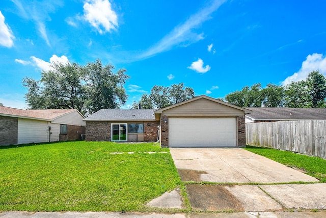 14511 Lourdes Dr, Houston, TX 77049 - ranch-style house with brick siding, a garage, and concrete driveway