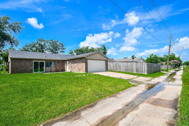 14511 Lourdes Dr, Houston, TX 77049 - view of front of property featuring brick siding, driveway, and a garage