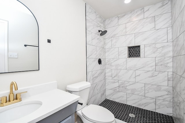 14511 Lourdes Dr, Houston, TX 77049 - bathroom with tiled shower, vanity, and recessed lighting