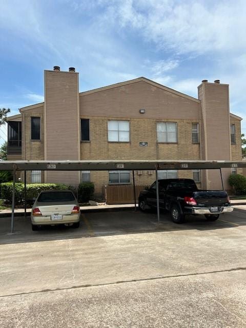 10555 Turtlewood Ct Unit 2111, Houston, TX 77072 - view of building exterior featuring covered parking