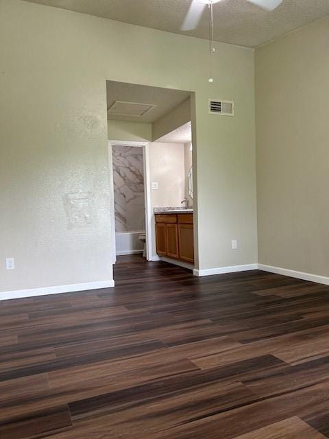 10555 Turtlewood Ct Unit 2111, Houston, TX 77072 - unfurnished room featuring dark wood-style floors, a ceiling fan, and attic access