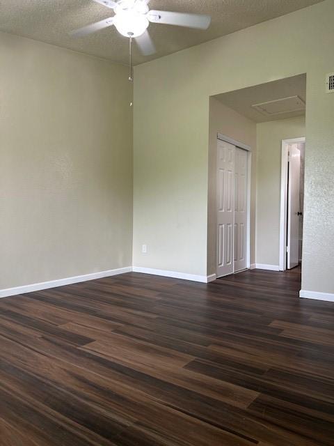 10555 Turtlewood Ct Unit 2111, Houston, TX 77072 - spare room with a ceiling fan and dark wood-style floors