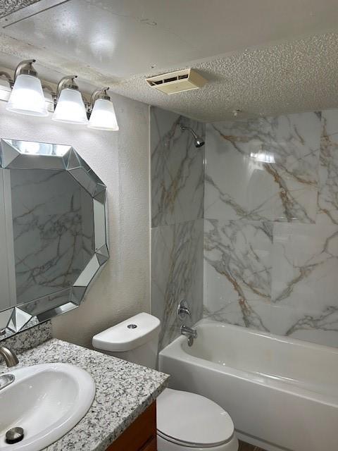 10555 Turtlewood Ct Unit 2111, Houston, TX 77072 - bathroom featuring vanity, shower / bath combination, and a textured ceiling