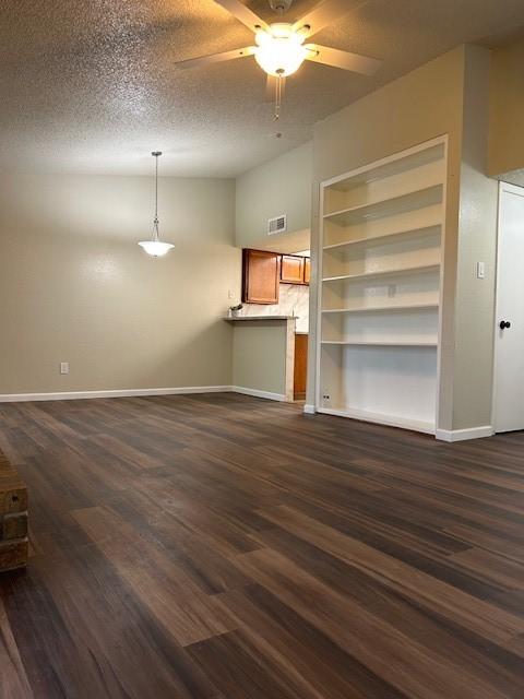 10555 Turtlewood Ct Unit 2111, Houston, TX 77072 - unfurnished living room with a ceiling fan and dark wood-style floors