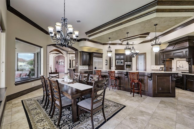 7507 Emerald Meadow Ct, Katy, TX 77494 - dining area with ornamental molding, a chandelier, and arched walkways